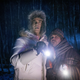 Cheyenne Jackson and Harvey Guillén in the dark woods in a still from Werewolves Within.